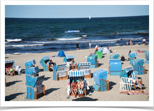 Backs of the beach chairs to the wind.